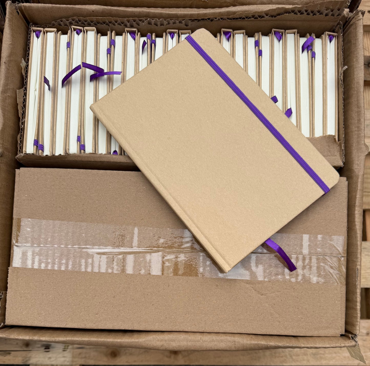 BOX OF 50 A5 HARDBACK NOTEBOOKS WITH PURPLE ELASTIC CLOSURE