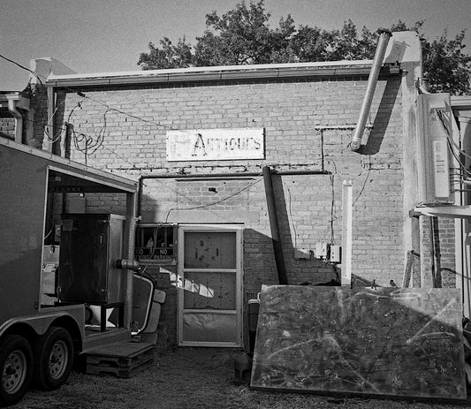 a black and white photo of a brick building