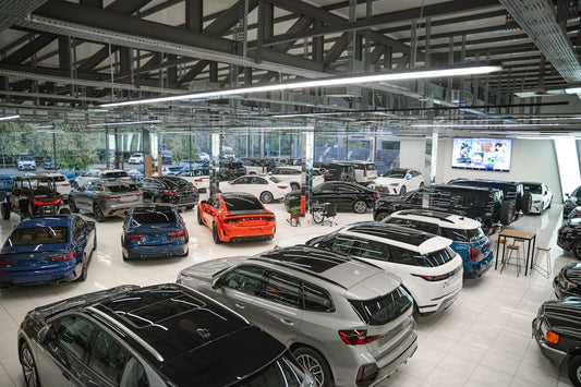 a bunch of cars are parked in a garage