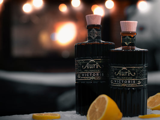 Bottles of liquor sit with lemon slices.