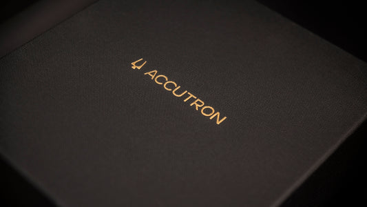 The accutron logo is displayed on a box.