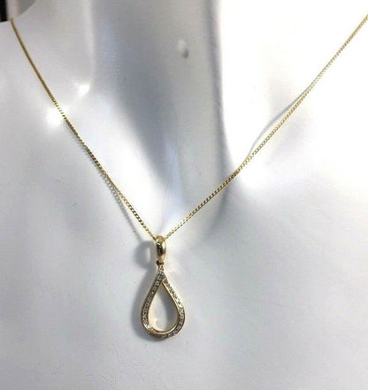 0.09CT DIAMOND TWIST PENDANT /9CT YELLOW GOLD IN GIFT BOX WITH VALUATION CERTIFICATE OF £895