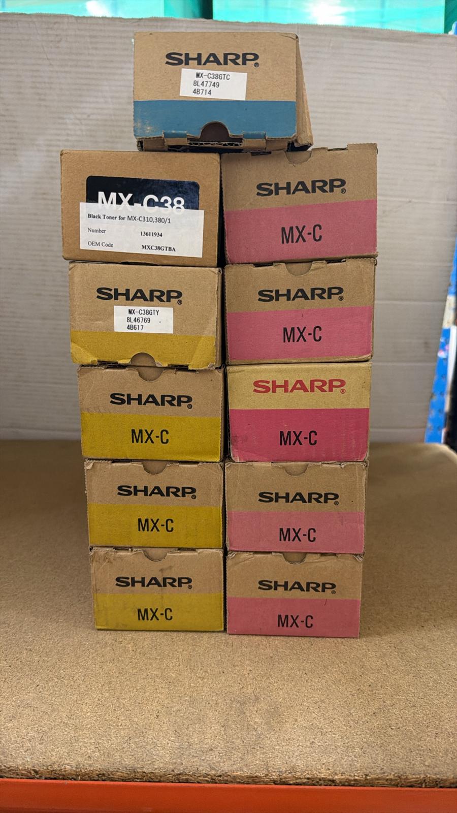 LARGE LOT OF BRAND NEW ASSORTED GENUINE SHARP MX-C38 TONER CARTRIDGES (BLACK, CYAN, MAGENTA, YELLOW)